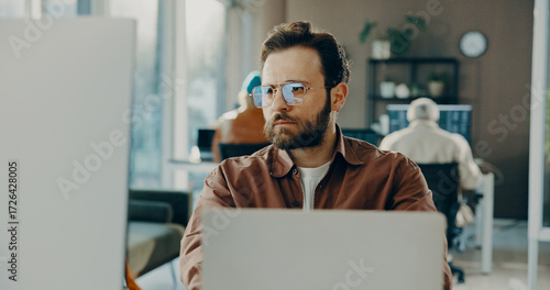 Obraz na plátně Reading, computer and business man in office for software development, online project or review