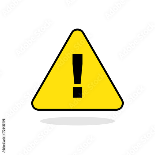 A yellow triangular warning sign with a black exclamation mark, casting a shadow.