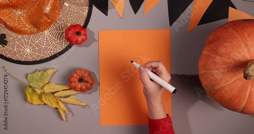Prepare for a Halloween party. Make a list of decorations and activities. Includes pumpkins, leaves, and a black and orange garland.