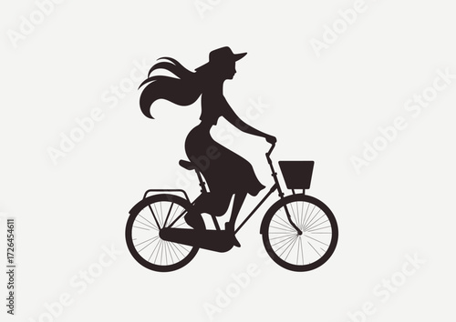 A woman rides a bicycle, her long hair flowing in the wind. She is dressed casually and enjoys the fresh air outdoors. The setting is bright and lively.