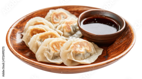 Pan fried dumplings with soy sauce isolated on a transparent background