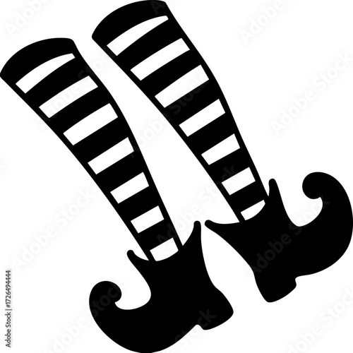 Striped witch legs with curled shoes create whimsical Halloween theme, perfect for festive decorations and playful designs