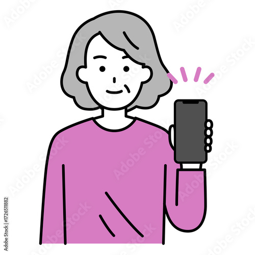 スマートフォンを手に持って見せる年配の女性
