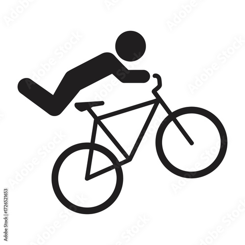 Silhouette of a person performing a bicycle stunt on a mountain bike