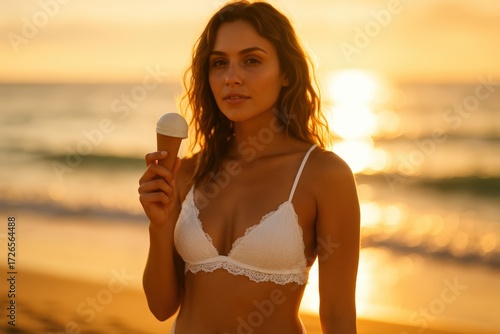 Young Woman Wearing White Lingerie Holding Ice Cream Cone on Beach at Sunset