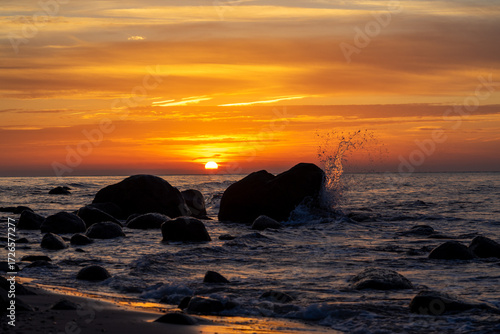 Fototapeta Naklejka Na Ścianę i Meble -  sunset on the beach with silhouettes of rocks on the island of Rügen on the Baltic Sea
