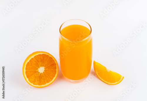 Full glass of orange juice and orange fruit on white background.
