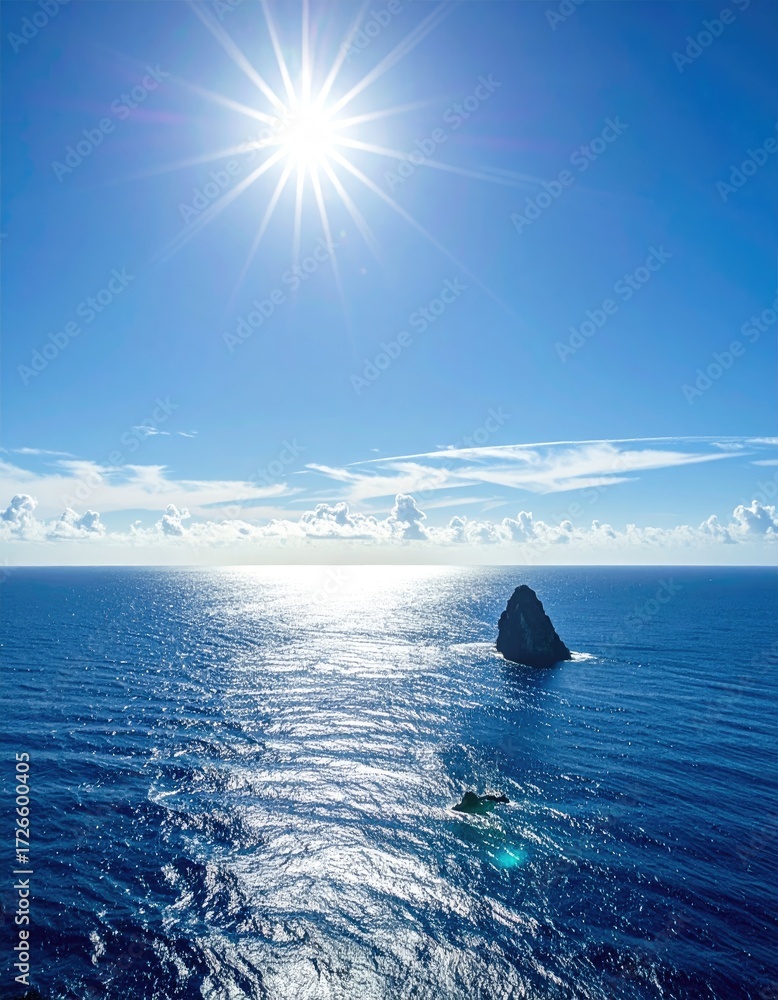 Fototapeta premium Vast ocean meets sky with a lone rock