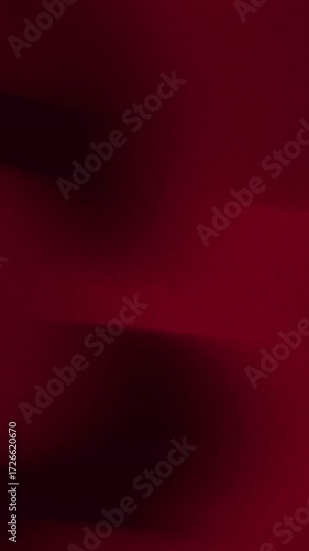 Abstract deep red background with subtle blurry horizontal lines creating a minimalist and elegant concept, perfect for design overlays or sophisticated digital backdrops