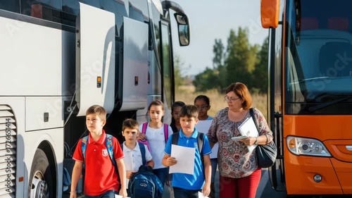 Group of students and teacher exiting a bus on a sunny day after a school trip adventure together