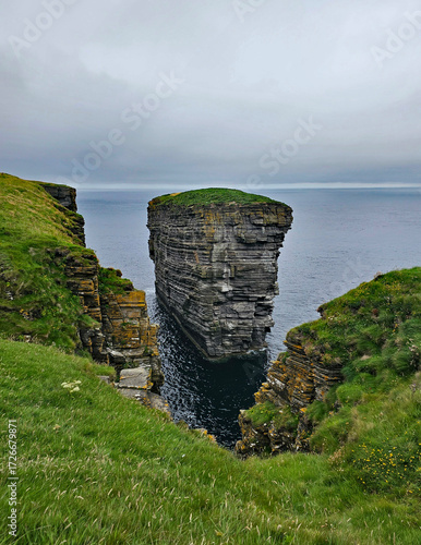 Wonderful views of the cliffs with islands and birds in the Scottish Highlands near Thurso