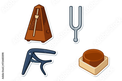 Essential musical accessories for instrument practice and tuning, featuring a classic metronome, metal tuning fork, guitar capo, and string instrument mute