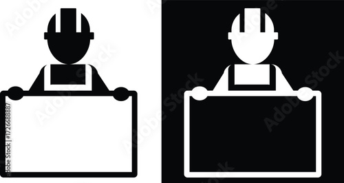 Construction worker holding a blank sign in black and white.