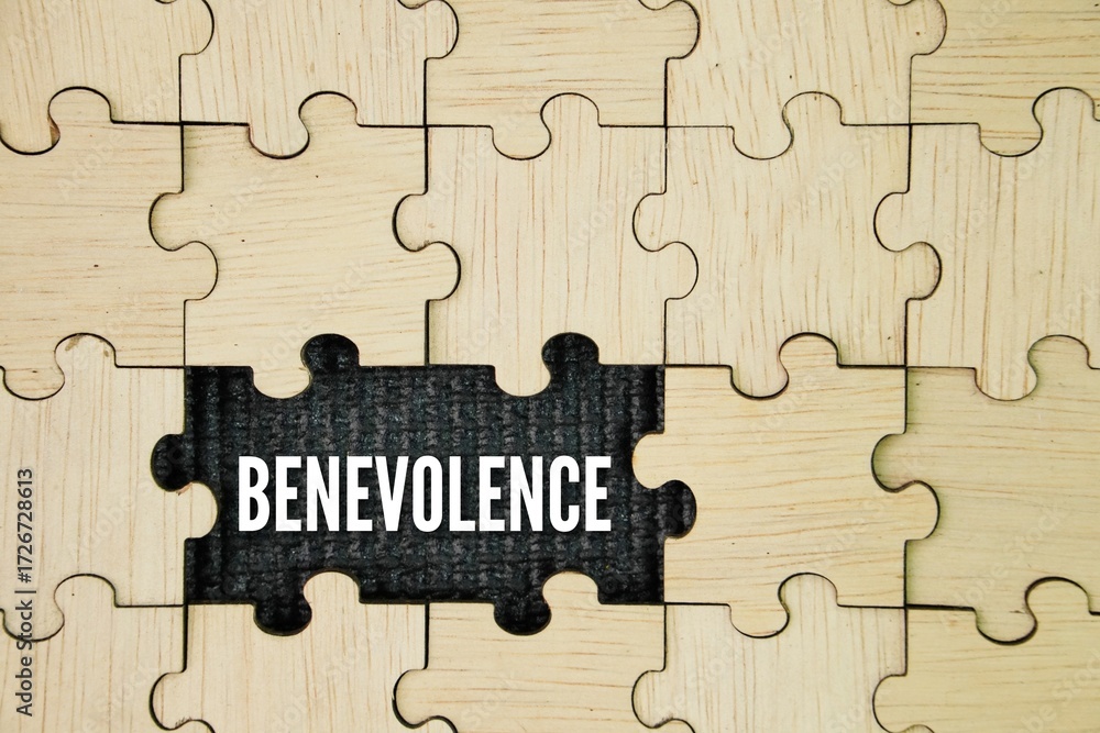 Fototapeta premium Wooden puzzle with the word benevolence. volunteer concept. desire to do good to others; goodwill; charitableness. to be filled with benevolence toward one's fellow creatures