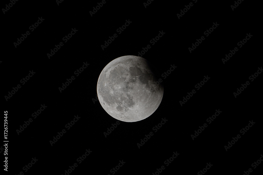 Obraz premium Partial lunar eclipse (ending phase)