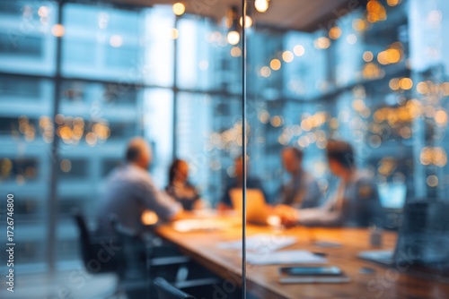 Wallpaper Mural a business team is having a meeting in a conference room with glass walls, with a blurred background. this abstract business concept could be used for a banner design. Torontodigital.ca
