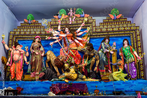 Vibrant Durga Puja Shrine With Goddess Durga And Attendants In Ornate Backdrop