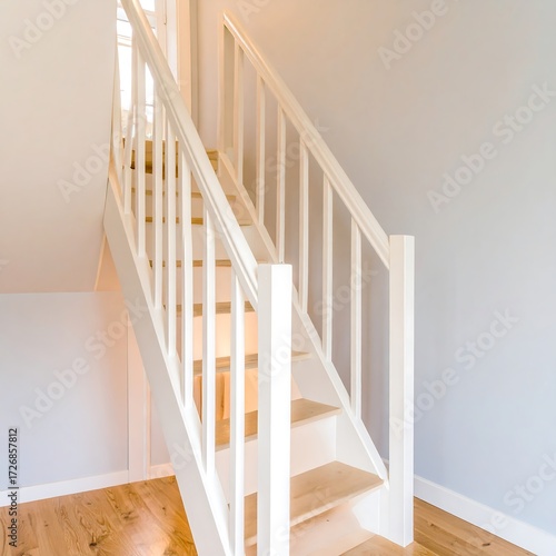 White wooden stairs ascending to upper floor