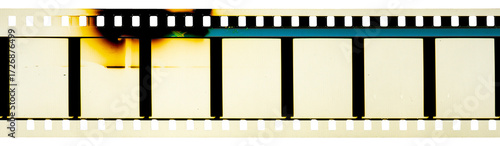 35 mm filmstrip with analog film burn effect, film noise texture and background, old film frame from analog retro film roll, photo texture with grain and scratches for vintage effect with damaged film