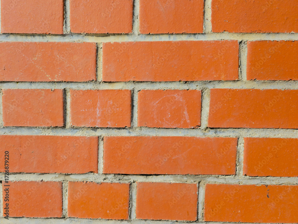 Obraz premium Red brick wall with horizontal mortar pattern closeup