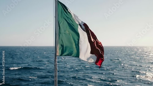 Italian flag waving over a body of water