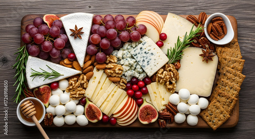 Flat lay of festive charcuterie board with cheese, fruit, and nuts