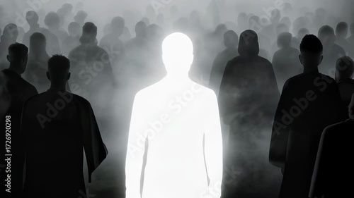 A single, bright figure stands out in a large, dark crowd enveloped by fog