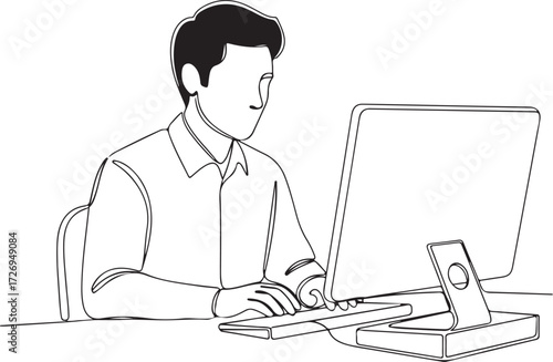 Businessman in a suit sitting at his desk and working on his laptop in the office