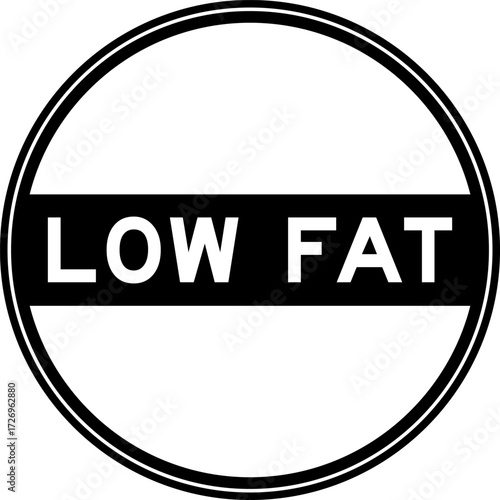 Black color round seal sticker in word low fat on white background
