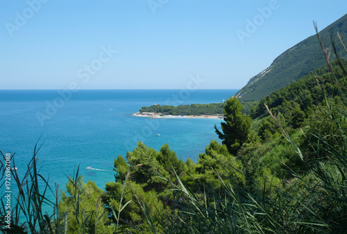 Sunny day at the cliffs in Marche, Italy. Coastline, horizontal line, natural background. turquoise water