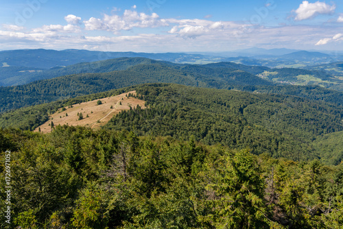 Fototapeta Naklejka Na Ścianę i Meble -  A view of Polana Stumorgowa and Beskidy mountains  from Mogielica mountain, Beskid Wyspowy, Poland