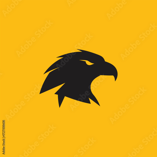 Dynamic Black Eagle Head Logo Symbolizing Powerful Vision and Majestic Strength on a Vibrant Yellow Background