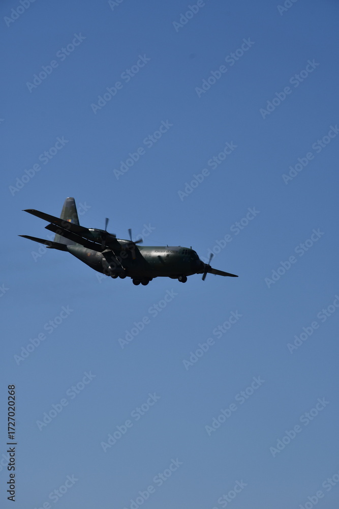 Fototapeta premium Hercules aircraft flying in the sky