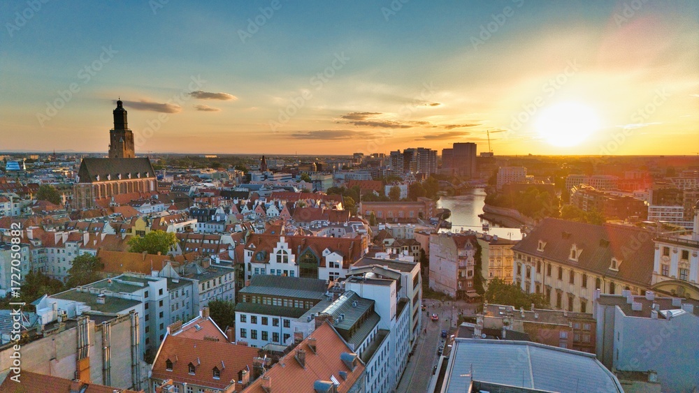 Fototapeta premium Golden Hour Aerial Panorama of Wrocław Old Town with Market Square, Historic Tenement Houses and Gothic Architecture in the Heart of Poland