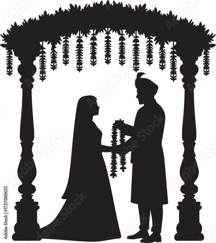 Indian wedding ceremony silhouette couple exchanging garlands