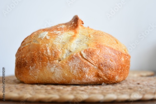 loaf of bread on wooden table