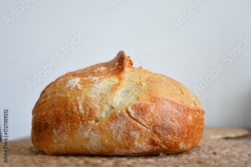 loaf of bread on wooden table