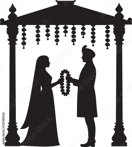 Indian wedding ceremony silhouette couple exchanging garlands