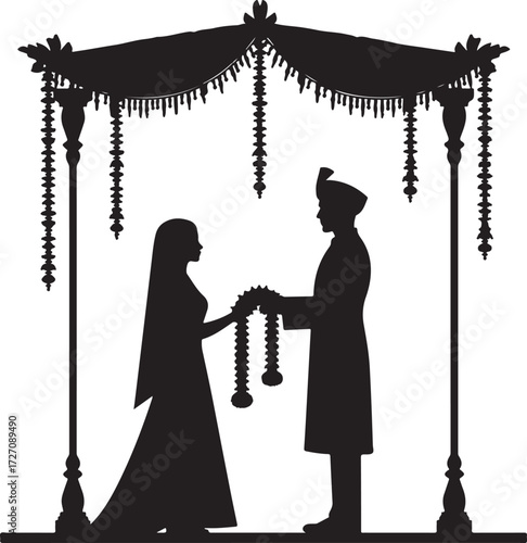 Indian wedding ceremony silhouette couple exchanging garlands