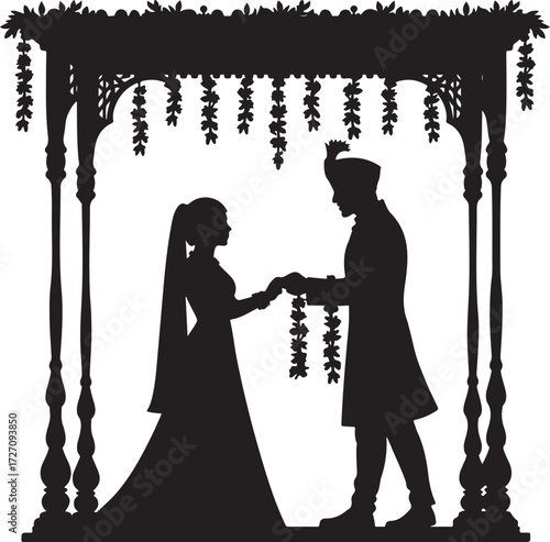 Indian wedding couple silhouette under floral canopy