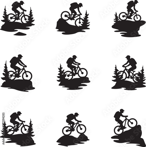 Mountain biker silhouette on rocky terrain with pine trees