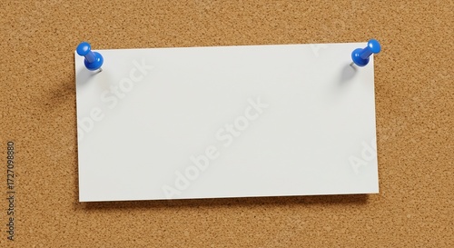 Blank white note paper with blue pushpins on a cork bulletin board, providing empty copy space for a message or announcement