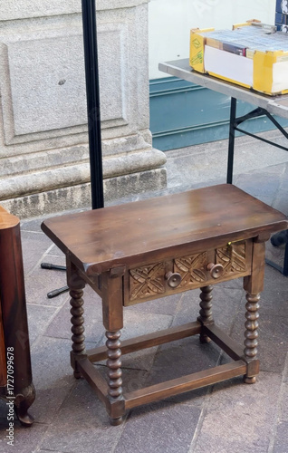 Obraz na plátně Sturdy antique wooden table with intricate carvings, perfect for vintage aficion