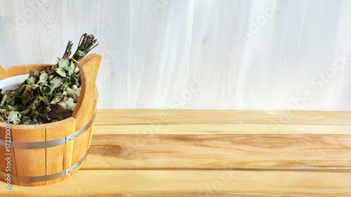 Fotografie Rustic sauna bucket filled with fragrant herbs, whispering Finnish folklore, Nor