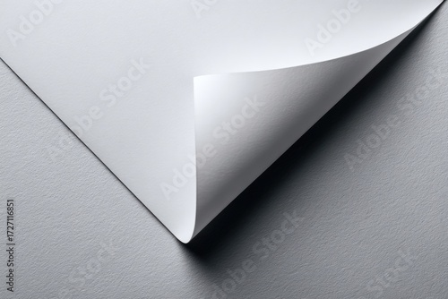 Folded white paper on gray surface