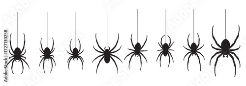 A collection of eight black spider silhouettes hanging from thin threads on a white background, perfect for Halloween decorations.