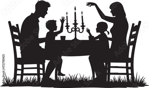 Family silhouette at candlelit dinner table with grass