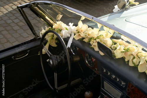 Classic convertible decorated with yellow flowers for a wedding or special occasion. Brussels, Belgium