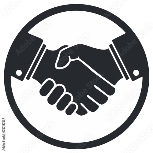 Two businesspeople shake hands to symbolize agreement, cooperation, partnership, or contract