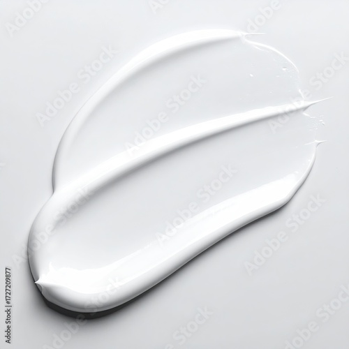 Smooth, white cream smear on a light background